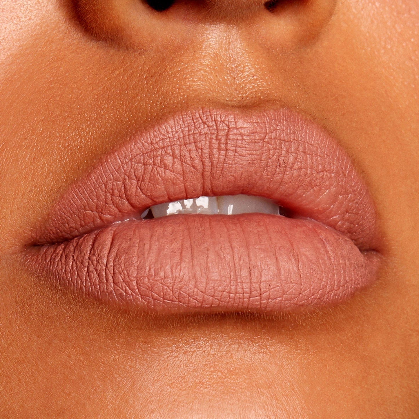 Full lips lined and filled with BFF Lippie Pencil by ColourPop in a nude-rose matte, showcasing precise definition and smooth payoff; studio close-up highlighting the long-wearing ColourPop Lippie Pencil finish.