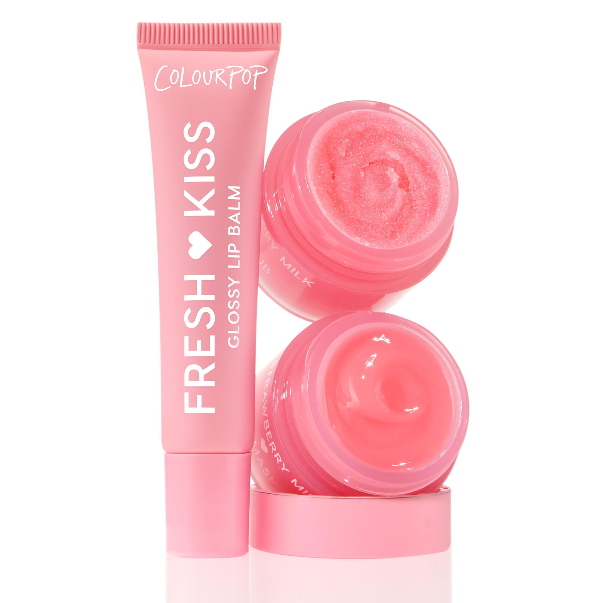 Strawberry Feels ColourPop Lip Care Kit featuring a pink Fresh Kiss Glossy Lip Balm tube beside two stacked open jars - sparkling strawberry sugar scrub and creamy hydrating lip mask - set in bright pink packaging on a white background.