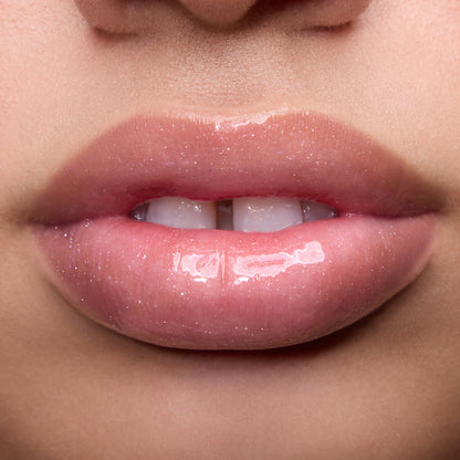 Close-up of models’ lips wearing Colourpop Fresh Kiss Glossy Balm in Raspberry Crème, showing sheer pink shimmer Lip Gloss & Lip Oil finish on different skin tones against a simple studio background.