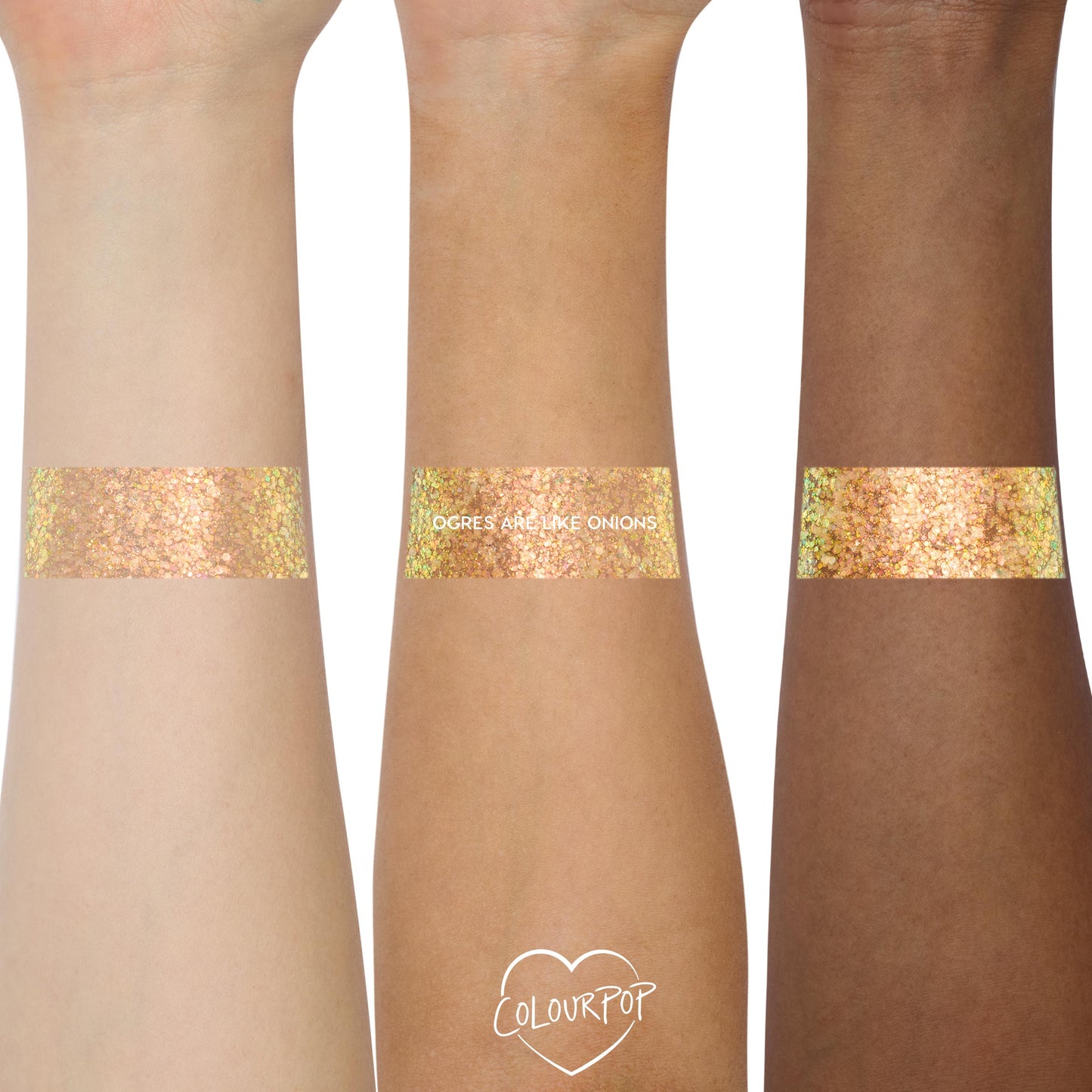 Wide swatches of ColourPop Glitter Gel, Ogres are Like Onions, brushed across three forearms to show payoff - peachy gold chunky hex glitter with a green iridescent shift and high sparkle - shot close-up on a clean white studio background.