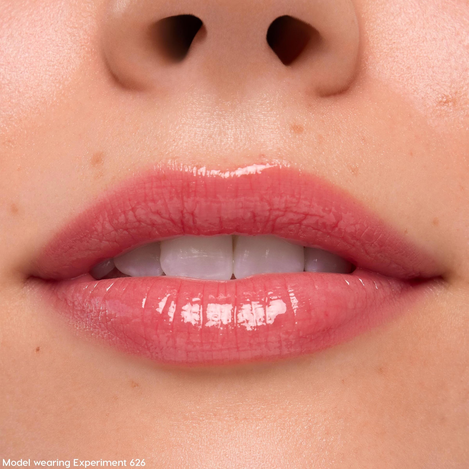 Lips coated in Keepin’ It Sweet Ultra Glossy Lip (ColourPop Ultra Glossy Lip) gleam with a sheer pink, glassy finish in a tight close-up, highlighting smooth texture and shine around the mouth.